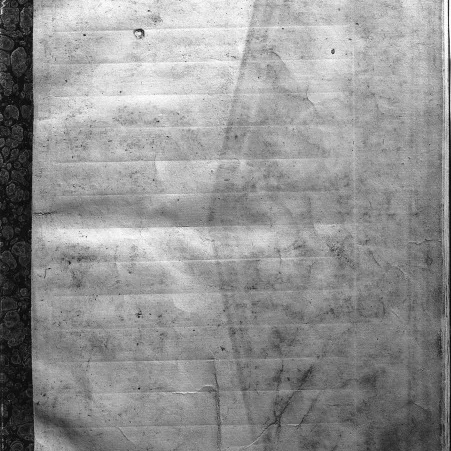 Close view of manuscript paper with impressed ruling lines created using a misṭara guide